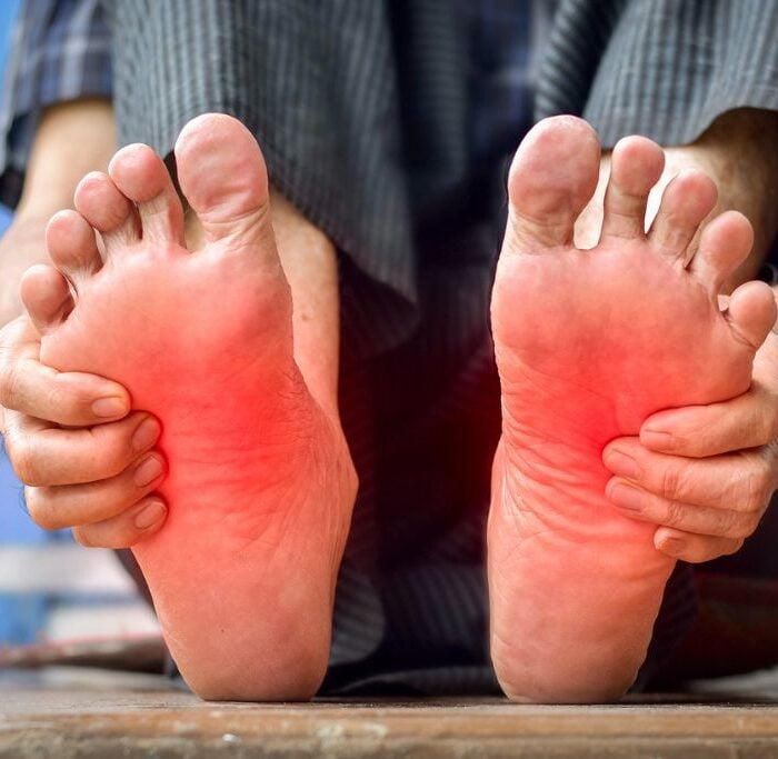 Photo of tingling and burning sensation in feet of older man, concept of opioids and neuropathy.