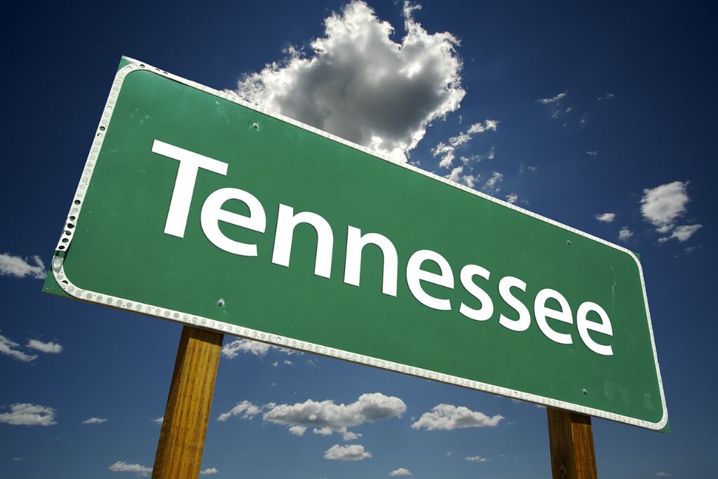 Photo of Tennessee road sign with dramatic clouds and sky, concept of Rapid Detox in Tennessee