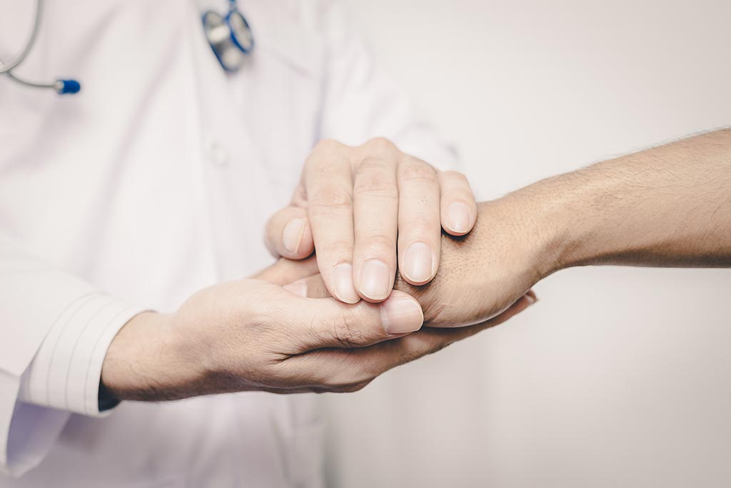 A close-up photo of doctor's hands holding patient's hand for encouragement and empathy, concept of overcoming heroin addiction in the midst of the fentanyl crisis
